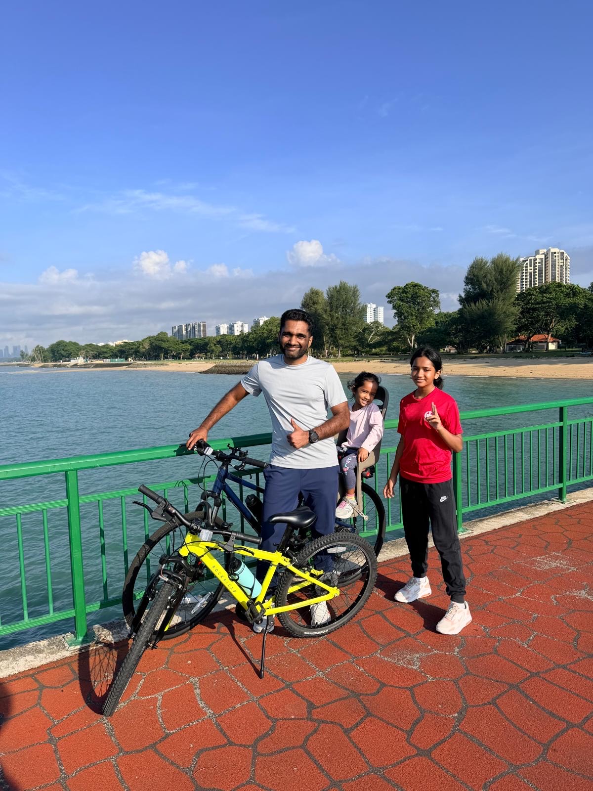 Cycling on a palm-lined road in Singapore