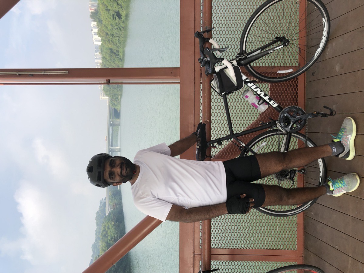 Bike and rider at the Singapore waterfront